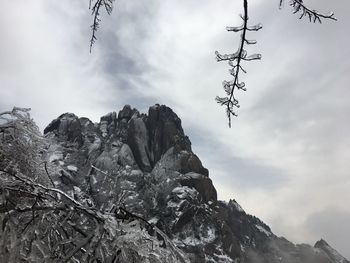 Low angle view of rock against sky