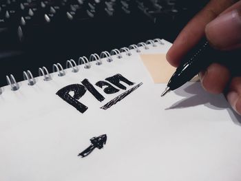 Close-up of hand holding paper