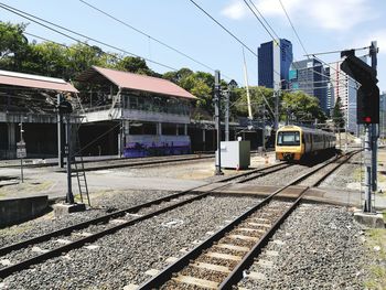 Train on railroad track against sky