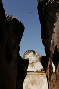 Low angle view of old ruin building against sky