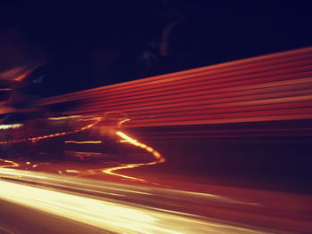 Light trails on illuminated city at night