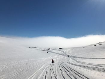 Scenic view of snow covered landscape against sky