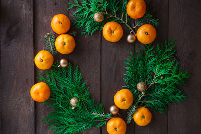 Directly above shot of orange fruits on wood