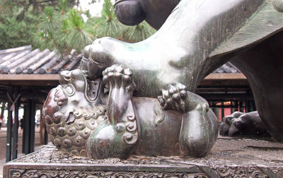 Close-up of statue against temple