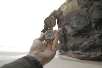 Close-up of hand holding rock