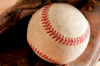 Close-up of baseball in glove