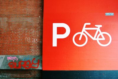 Close-up of text on brick wall