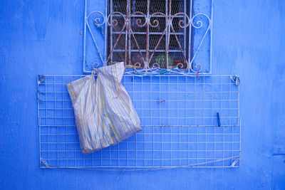 Clothes drying against blue wall