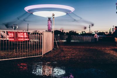 Close-up of red light against sky