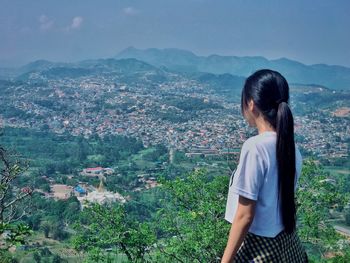 Woman looking at cityscape