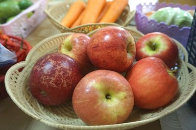 High angle view of apples in basket on table