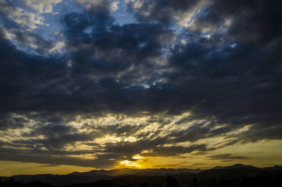 Scenic view of dramatic sky during sunset