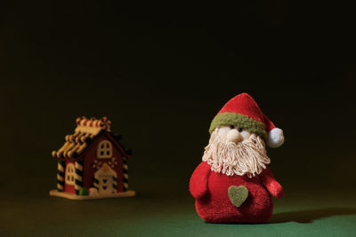 Close-up of christmas decorations over black background