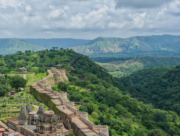 Scenic view of mountains against cloudy sky