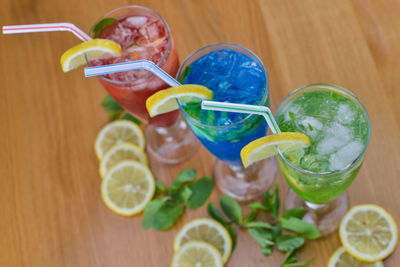 Fruits and colorful drinks on table