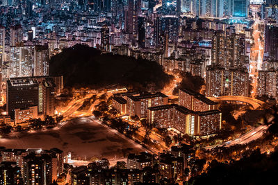 High angle view of illuminated buildings in city at night