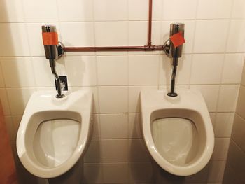 High angle view of urinals at bathroom