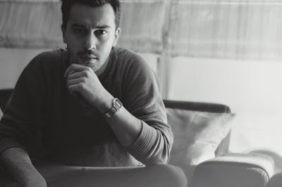 Portrait of young man sitting at home