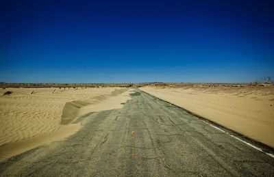 Scenic view of landscape against clear blue sky