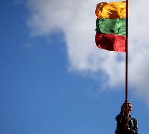 Low angle view of flag against sky