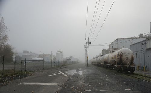 Train on railroad tracks against sky