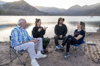 Family enjoying time together while relaxing outdoors in nature.