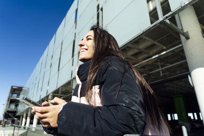 Beautiful woman using mobile phone.