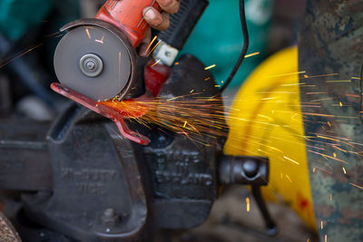 Man working on metal in factory