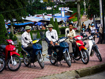 People riding bicycles on road