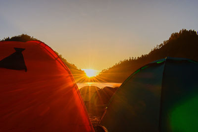 Tent against sky during sunset