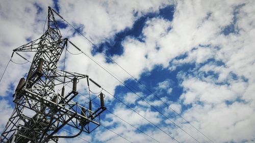 Low angle view of cables against sky