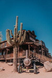 Low angle view of cactus against clear blue sky