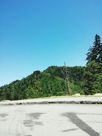 Scenic view of road against clear blue sky