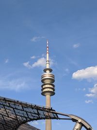 Low angle view of tower against cloudy sky