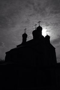 Low angle view of church against cloudy sky