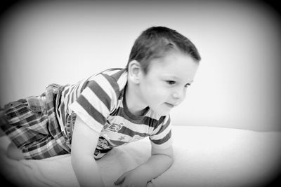 Portrait of cute boy sitting at home