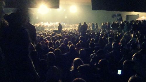 Rear view of people enjoying music concert