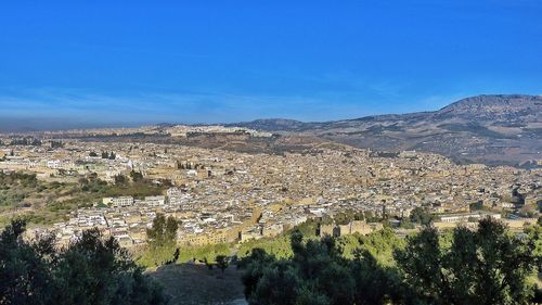 Aerial view of cityscape against clear sky