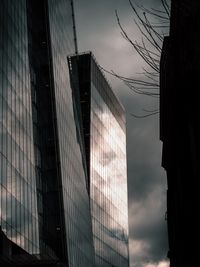 Low angle view of buildings against sky at dusk