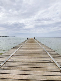 Pier over sea against sky