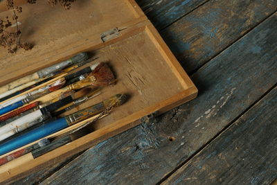 High angle view of paintbrushes on table