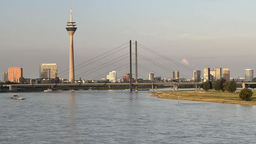 View of bridge over river with buildings in background