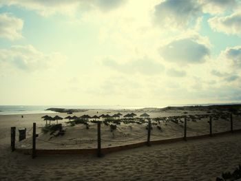 Scenic view of sea against cloudy sky