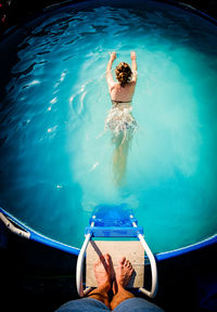 High angle view of woman swimming in pool