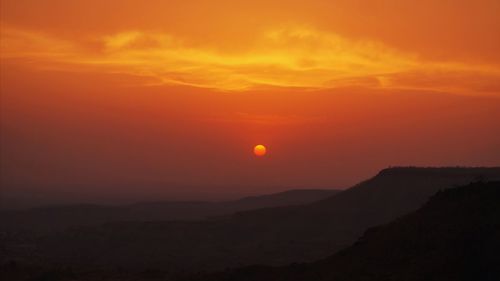 Scenic view of dramatic sky during sunset