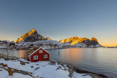 Scenic view of snowcapped mountains against clear sky during winter