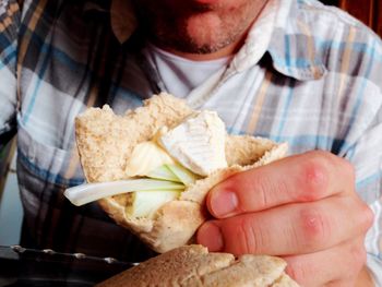 Close-up of man eating food