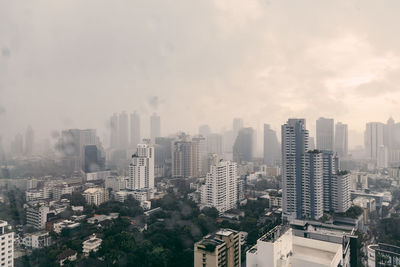 High angle view of buildings in city against sky