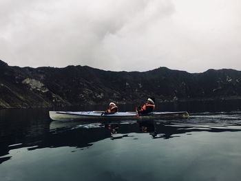 People kayaking in lake