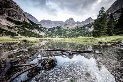 Scenic view of mountain against cloudy sky